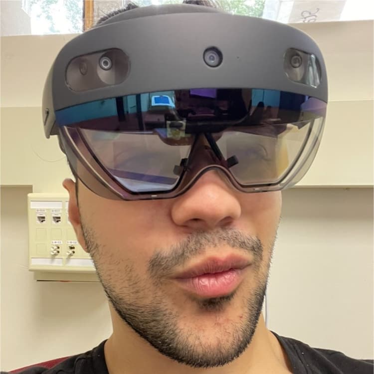 Ali Rezaei wearing a mixed reality headset